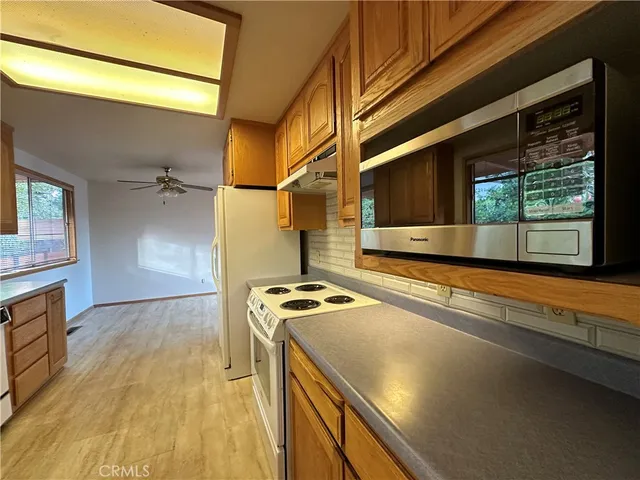 a view of a kitchen with a sink and dishwasher