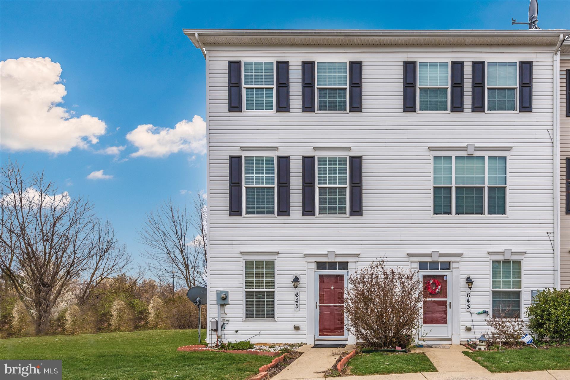 645 Tivoli Road Frederick, MD 21703 - Photo 1 of 21 a front view of a house with garden