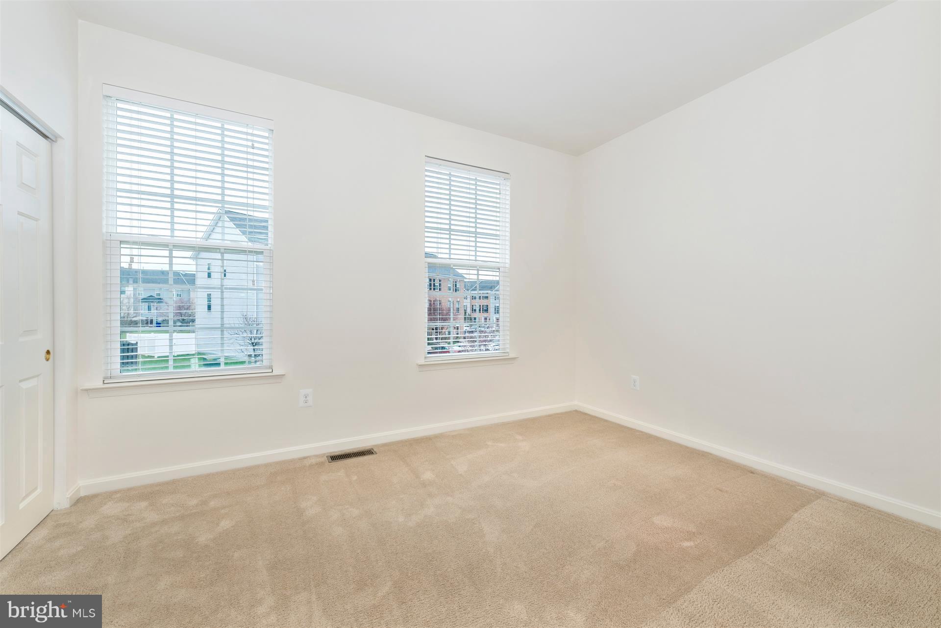 645 Tivoli Road Frederick, MD 21703 - Photo 8 of 21 an empty room with windows