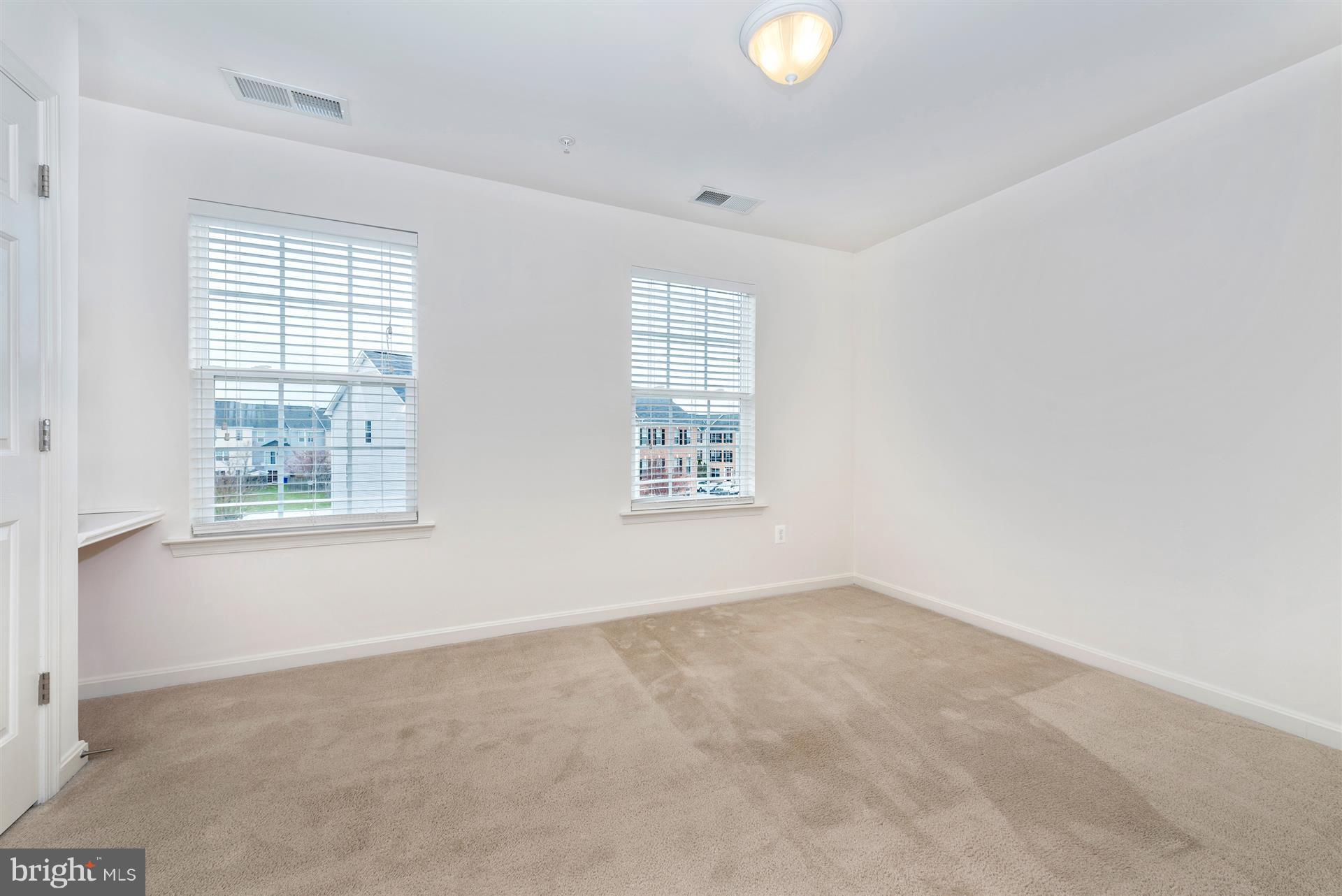645 Tivoli Road Frederick, MD 21703 - Photo 10 of 21 an empty room with windows