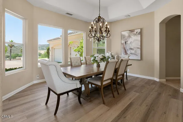 a kitchen with stainless steel appliances kitchen island granite countertop a sink and cabinets