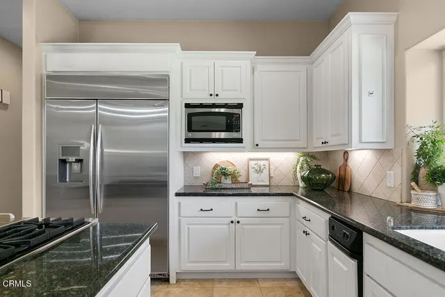 a bedroom with a large bed and a large window