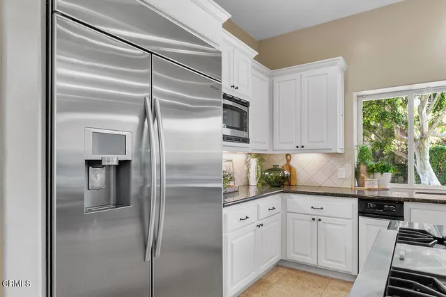 a living room with furniture window and wooden floor