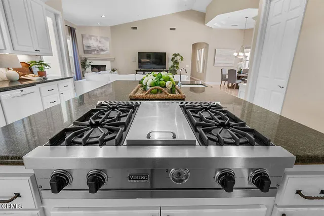 a view of living room kitchen with furniture and flat screen tv