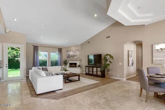 a bathroom with a granite countertop sink mirror and toilet