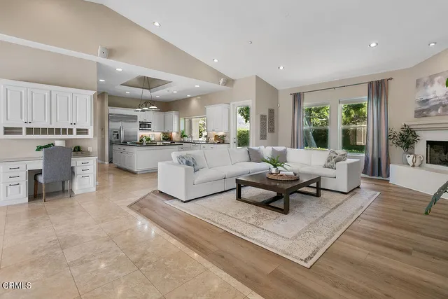 a large bathroom with a glass shower door and a mirror
