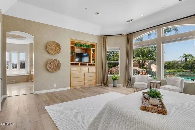 a bedroom with a bed and lamp