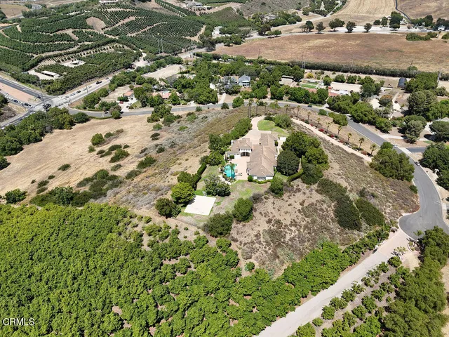 a dining room with furniture and a window