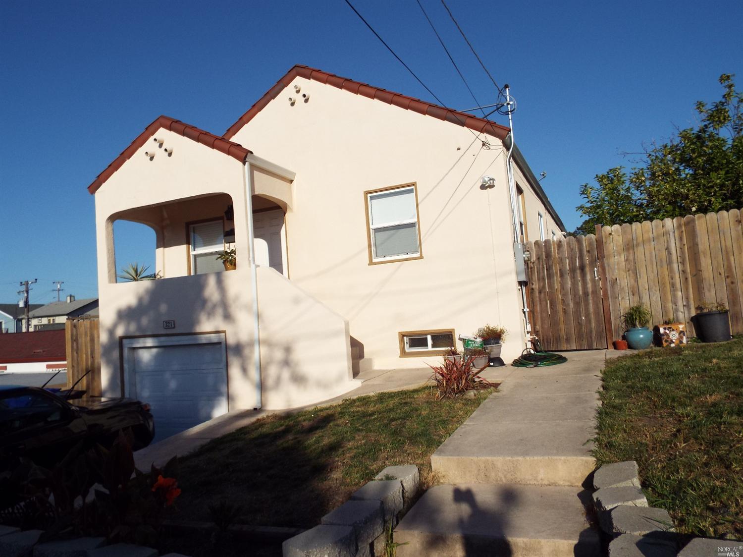 321 Napa Avenue Rodeo, CA 94572 - Photo 1 of 1 a backyard of a house with outdoor seating
