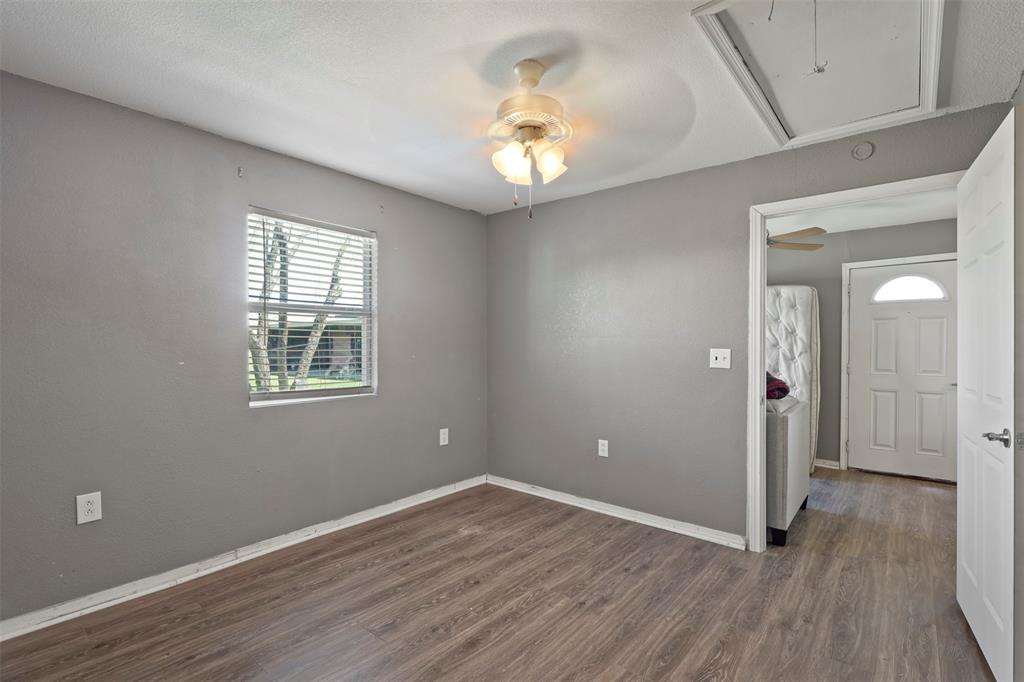 1556 John Wayne Road Kaufman, TX 75142 - Photo 26 of 33 wooden floor in an empty room with a window