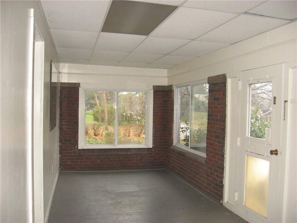 135 Freeport Road Butler, PA 16002 - Photo 4 of 18 Enclosed sunroom in the front of the home.
