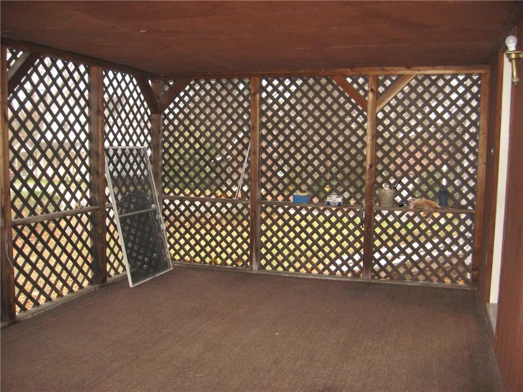 135 Freeport Road Butler, PA 16002 - Photo 10 of 18 Screened in porch on the side of the home.