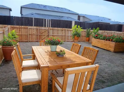 a view of a table and chairs in the patio