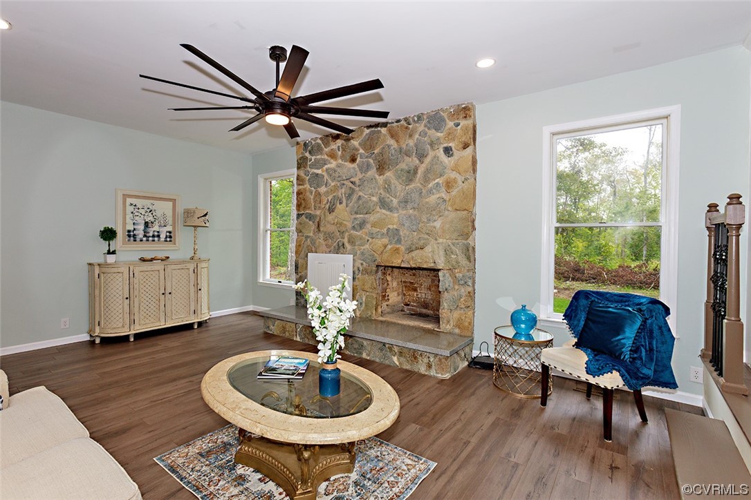 674 Spring Grove Road Spring Grove, VA 23881 - Photo 16 of 37 a living room with furniture a fireplace and a table