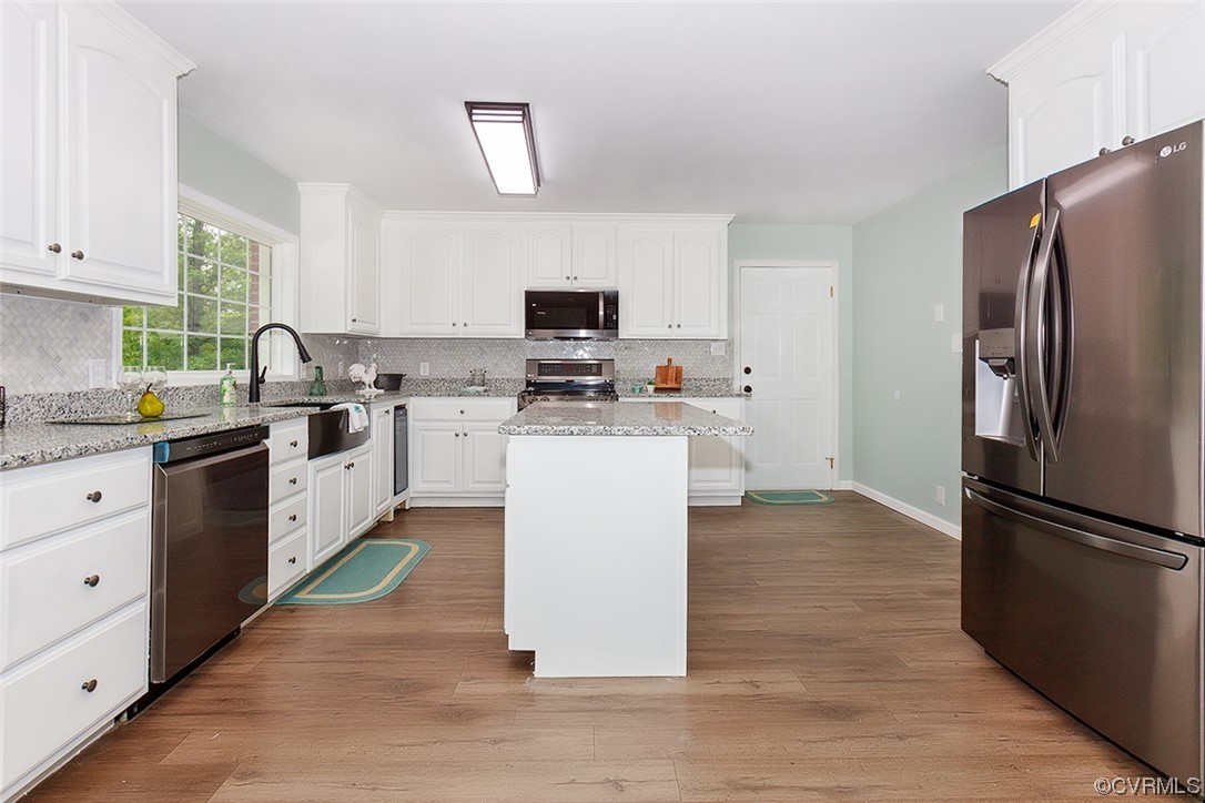 674 Spring Grove Road Spring Grove, VA 23881 - Photo 19 of 37 a kitchen with a refrigerator stove and sink