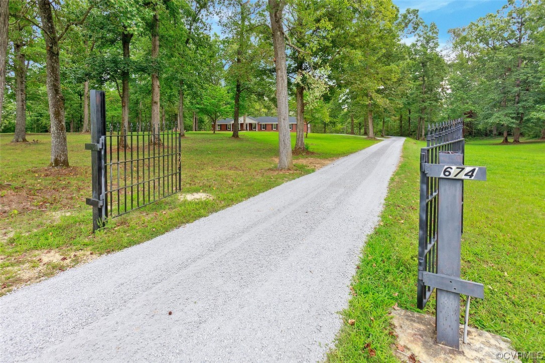 674 Spring Grove Road Spring Grove, VA 23881 - Photo 2 of 37 a view of a park with large trees