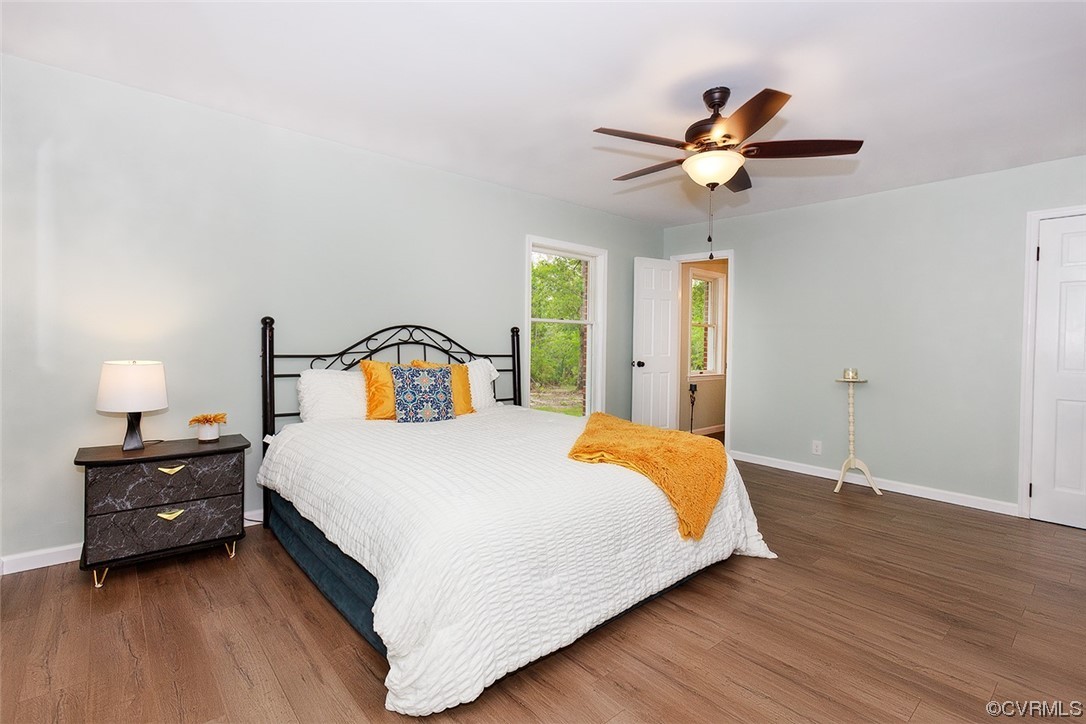 674 Spring Grove Road Spring Grove, VA 23881 - Photo 24 of 37 a bedroom with a bed and a chandelier
