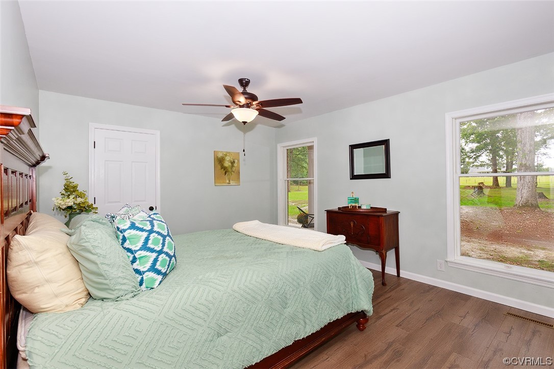 674 Spring Grove Road Spring Grove, VA 23881 - Photo 26 of 37 a bedroom with a bed and a chandelier