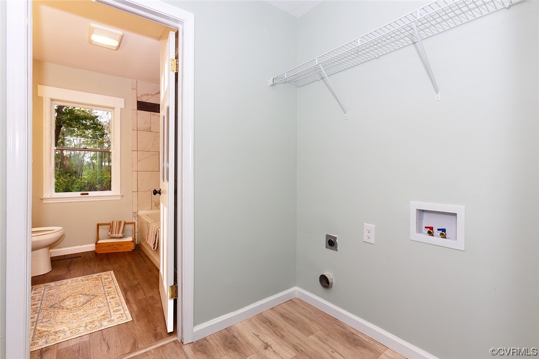 674 Spring Grove Road Spring Grove, VA 23881 - Photo 32 of 37 a view of a room with wooden floor and windows