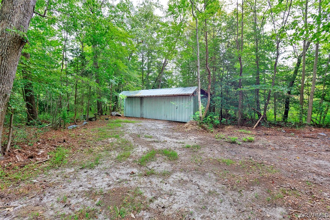 674 Spring Grove Road Spring Grove, VA 23881 - Photo 35 of 37 a view of a house with backyard and a tree