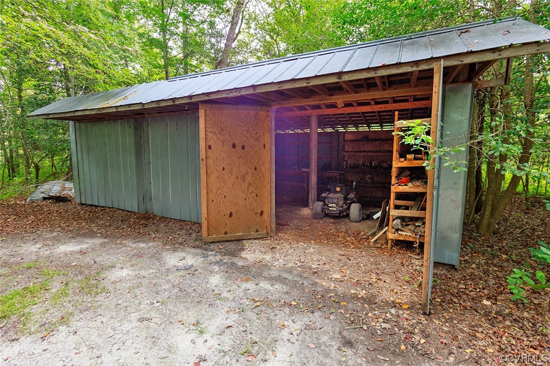 674 Spring Grove Road Spring Grove, VA 23881 - Photo 36 of 37 a view of a chair under an umbrella