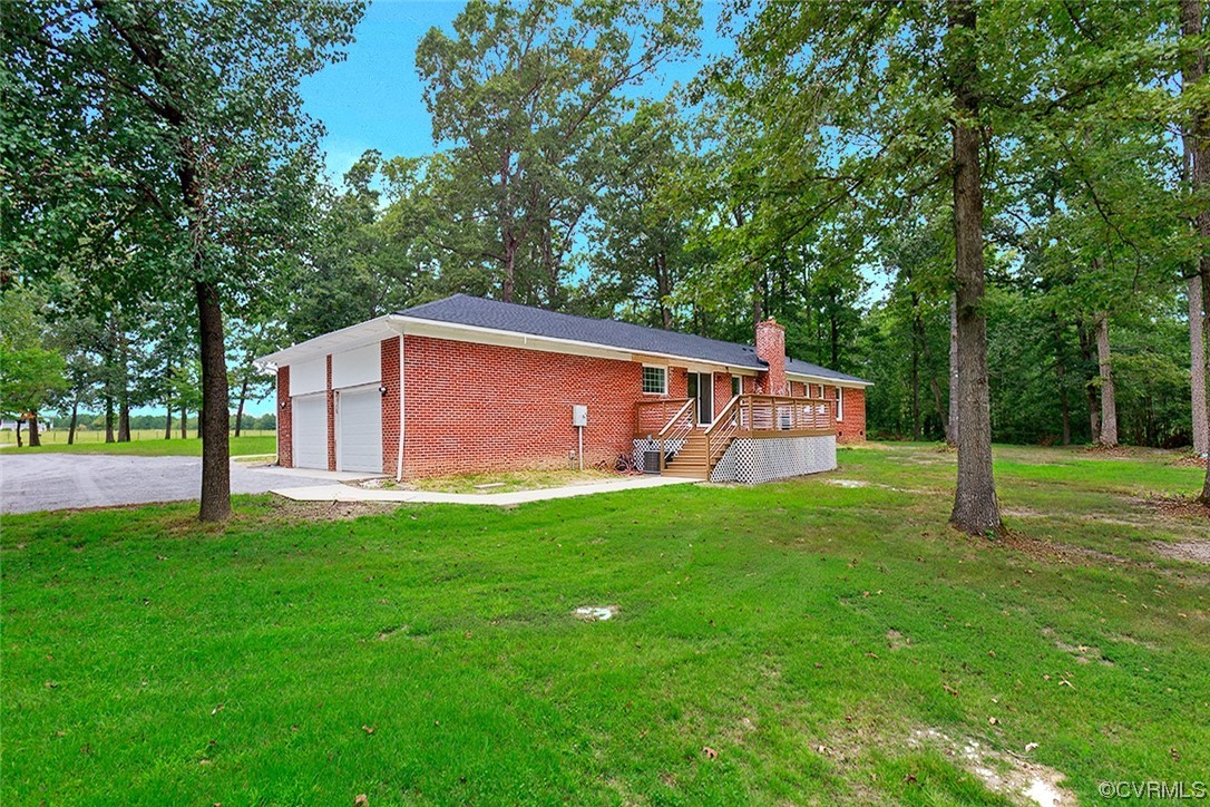 674 Spring Grove Road Spring Grove, VA 23881 - Photo 5 of 37 a backyard of a house with lots of green space
