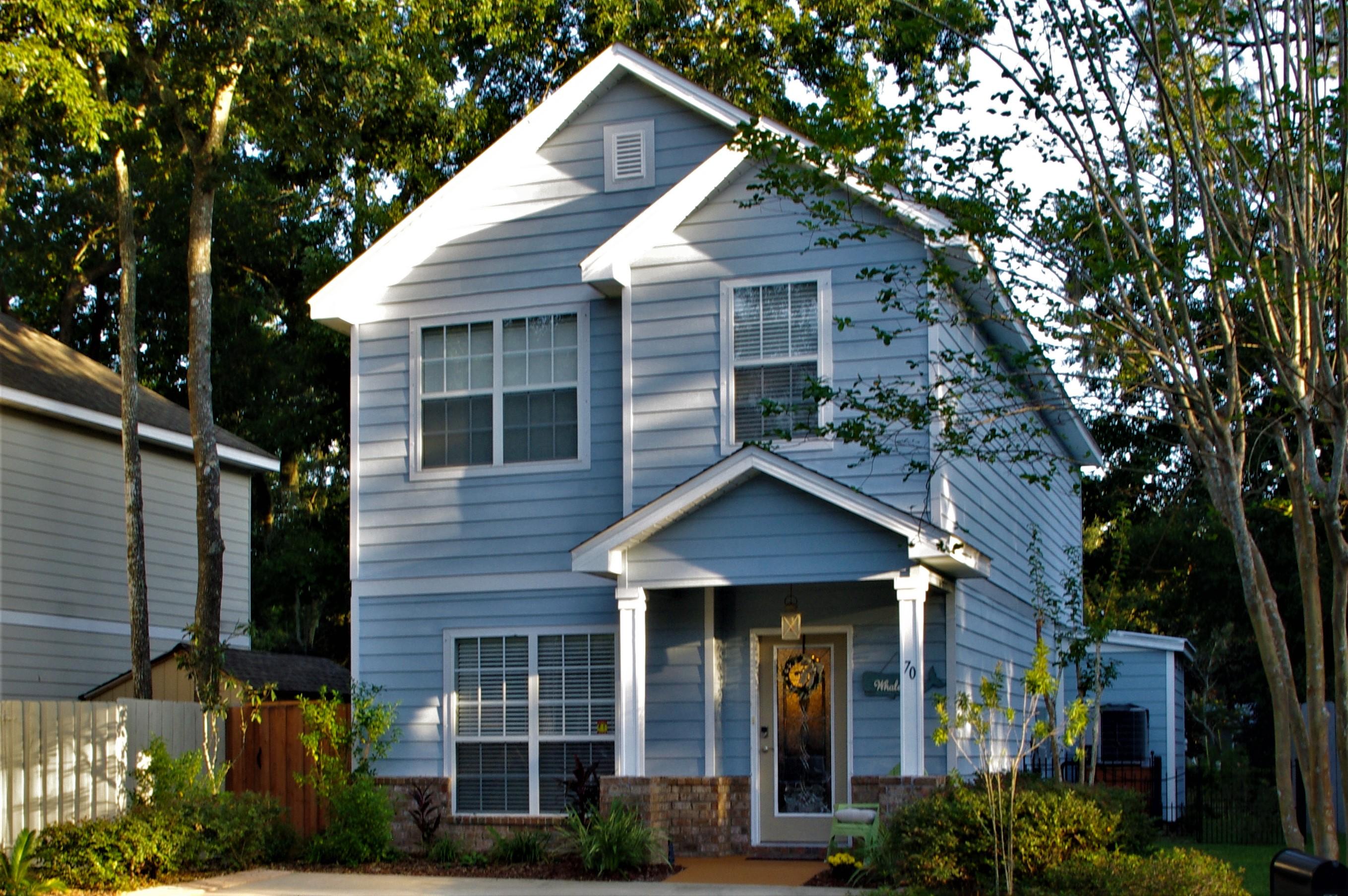 70 Beacon Point Drive Santa Rosa Beach, FL 32459 - Photo 1 of 19 a front view of a house with garden