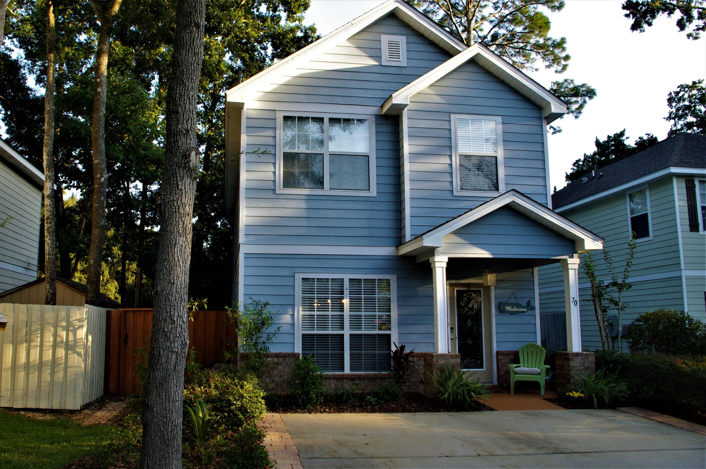 70 Beacon Point Drive Santa Rosa Beach, FL 32459 - Photo 2 of 19 a front view of a house with garden