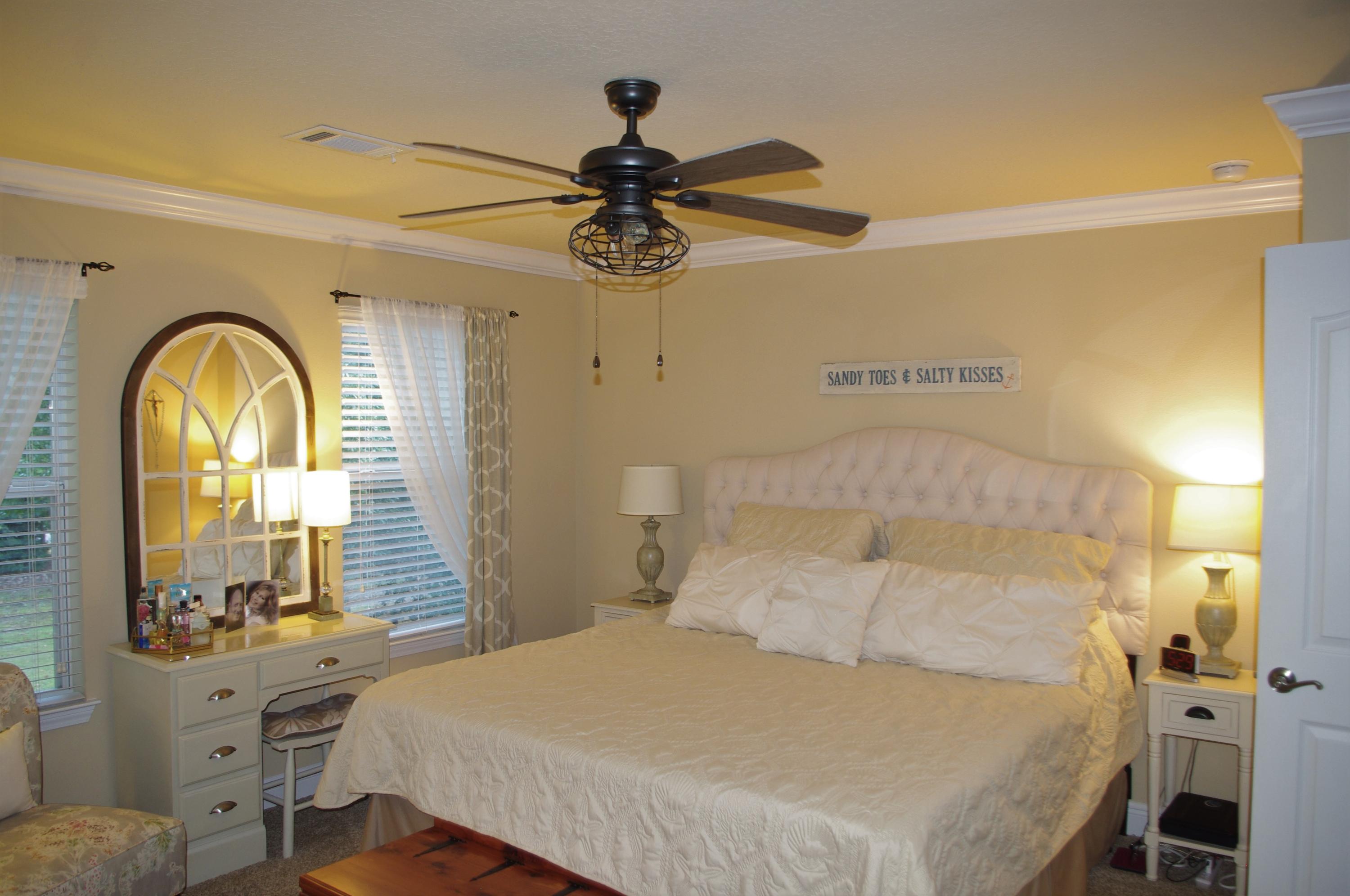 70 Beacon Point Drive Santa Rosa Beach, FL 32459 - Photo 7 of 19 a bedroom with a bed and a mirror