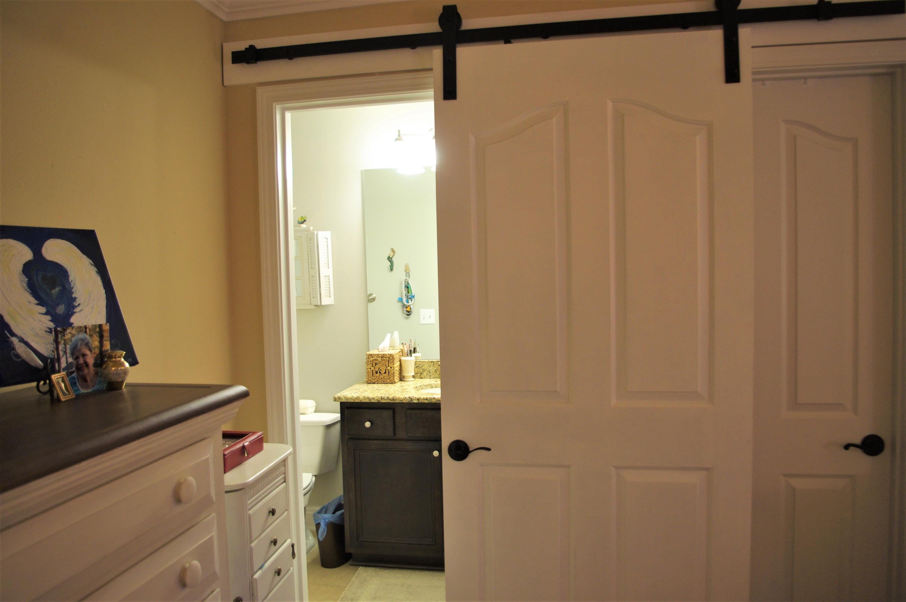 70 Beacon Point Drive Santa Rosa Beach, FL 32459 - Photo 9 of 19 a bathroom with a sink a mirror and a shower
