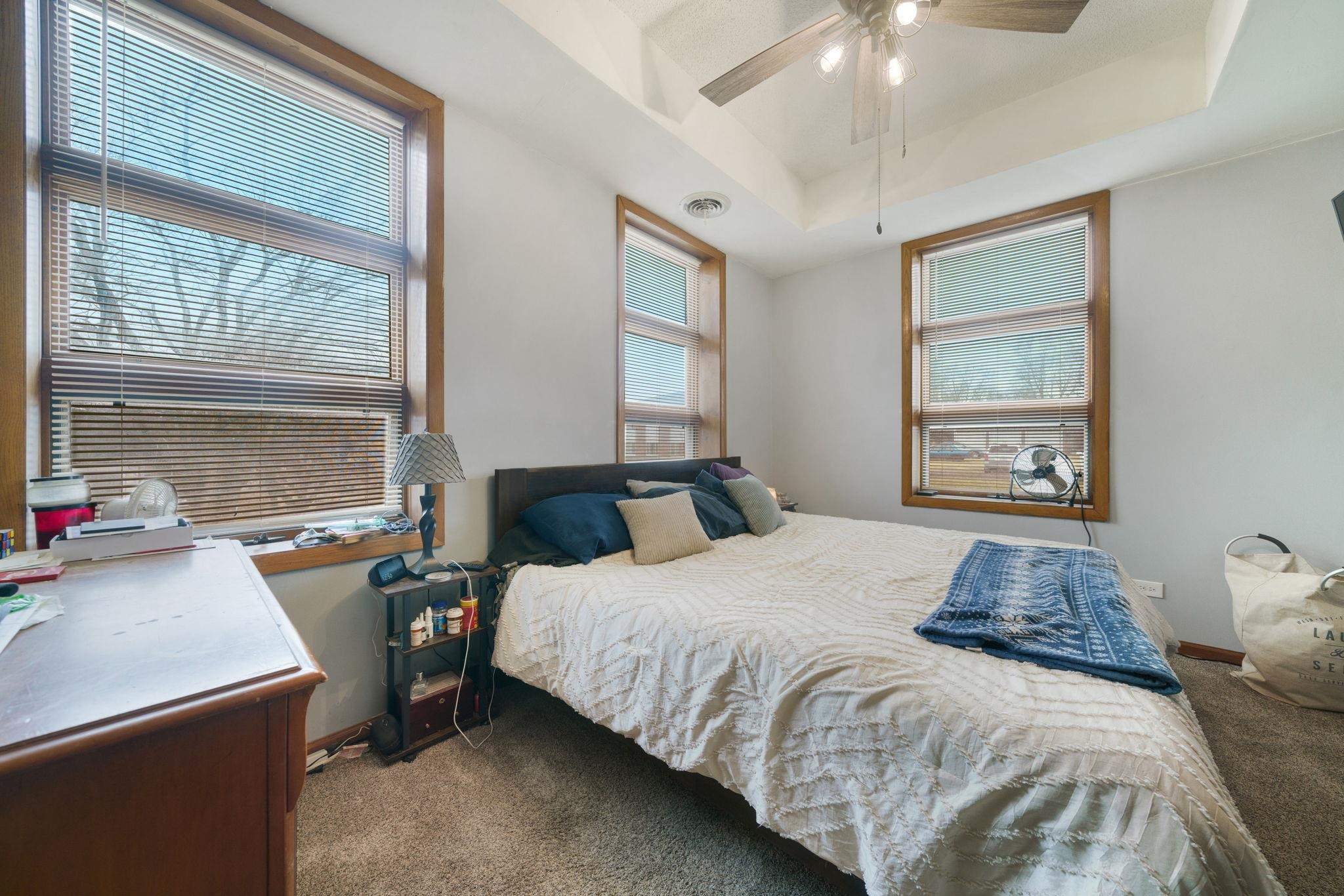 709 Franklin Street Oregon, IL 61061 - Photo 29 of 87 a bedroom with a bed and wooden floor