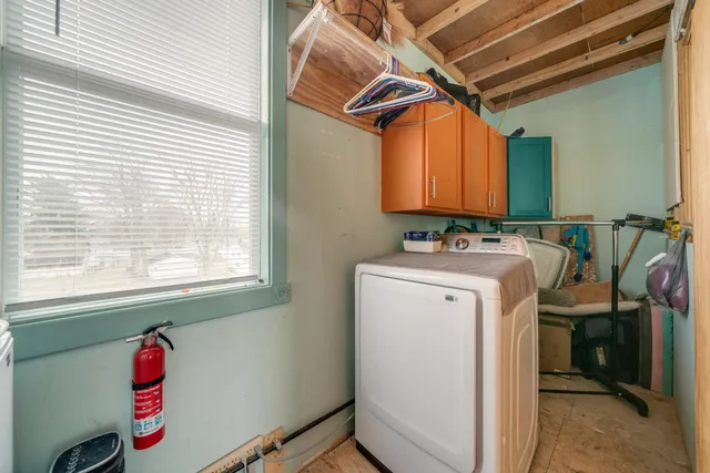 a kitchen with a refrigerator and a stove top oven