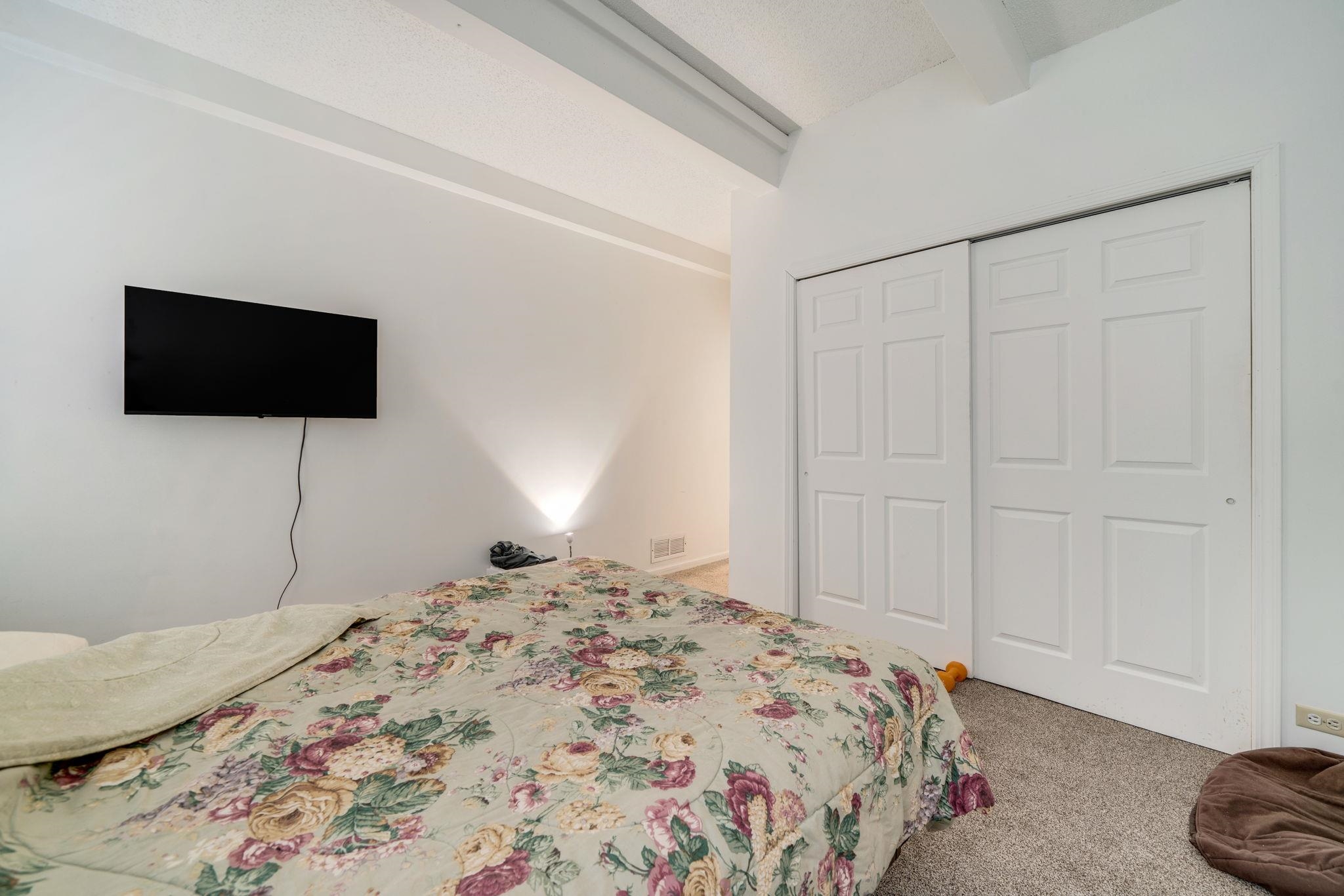 709 Franklin Street Oregon, IL 61061 - Photo 46 of 87 a bedroom with a bed and a flat screen tv