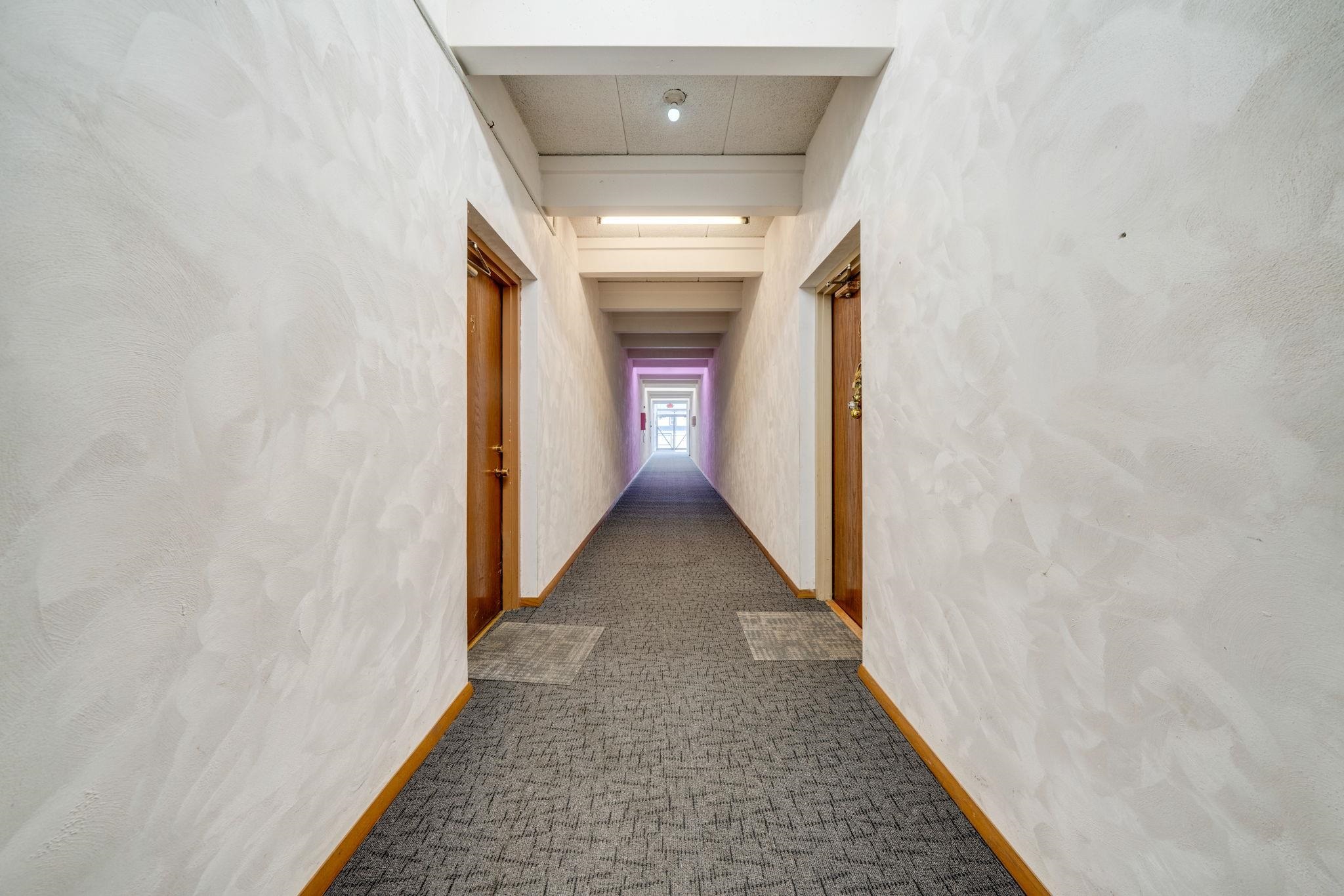 709 Franklin Street Oregon, IL 61061 - Photo 54 of 87 a view of a hallway with wooden floor and staircase