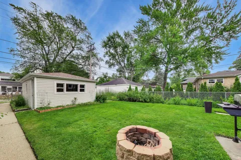 a house view with a sitting space and garden