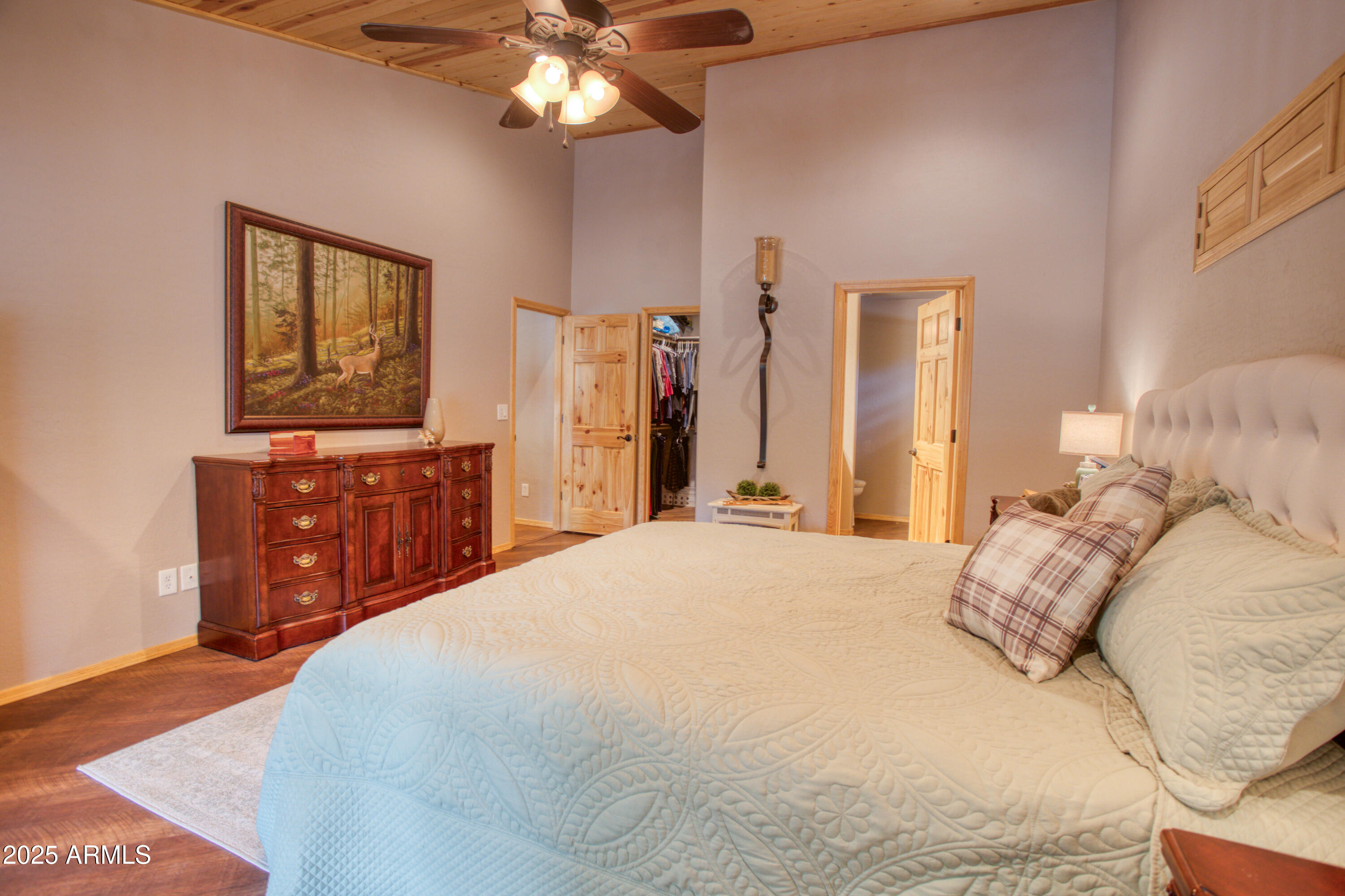 2050 Christmas Pine Road Overgaard, AZ 85933 - Photo 14 of 31 a bedroom with a bed and a dresser