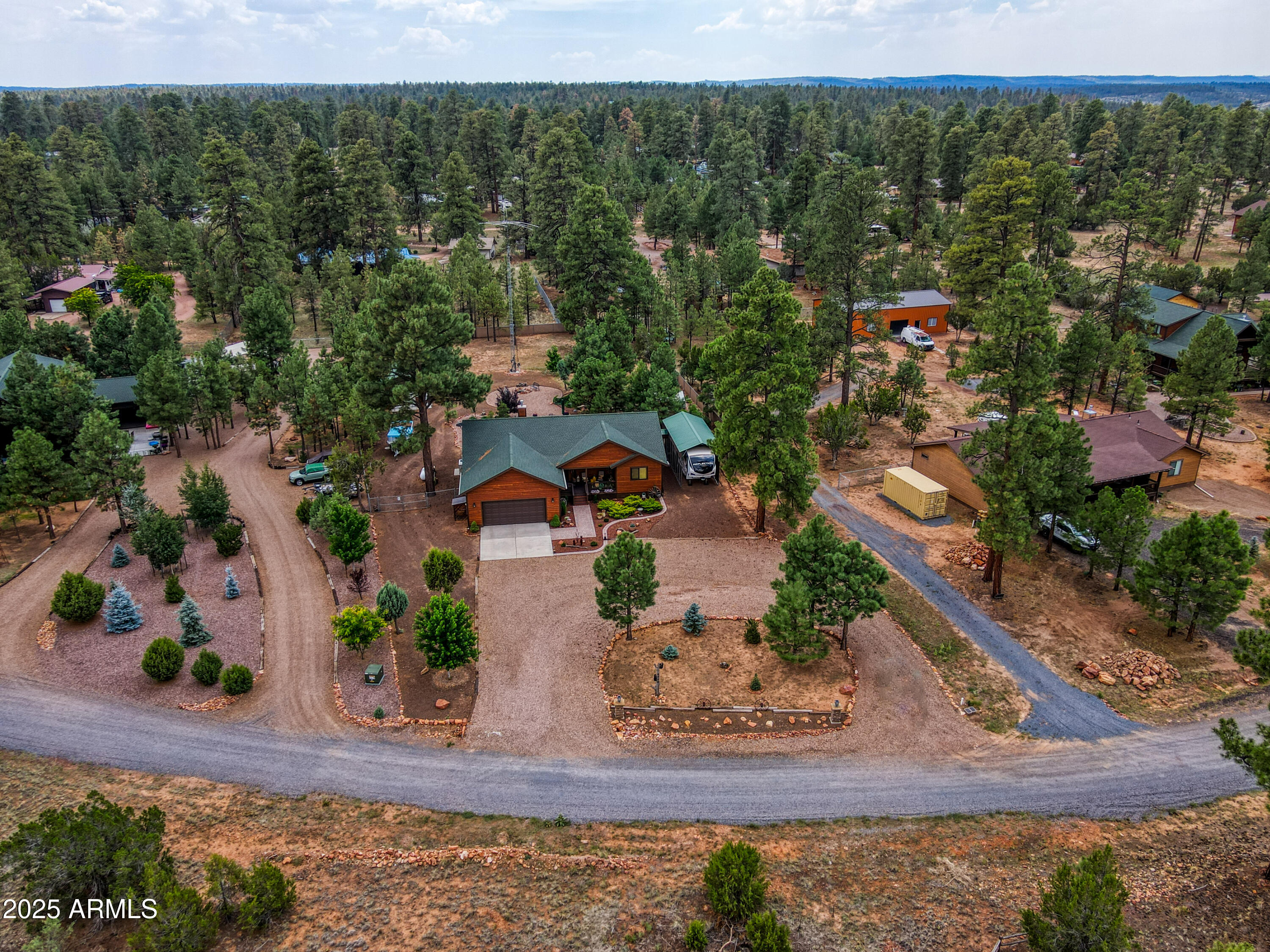 2050 Christmas Pine Road Overgaard, AZ 85933 - Photo 27 of 31 an aerial view of a house with a yard