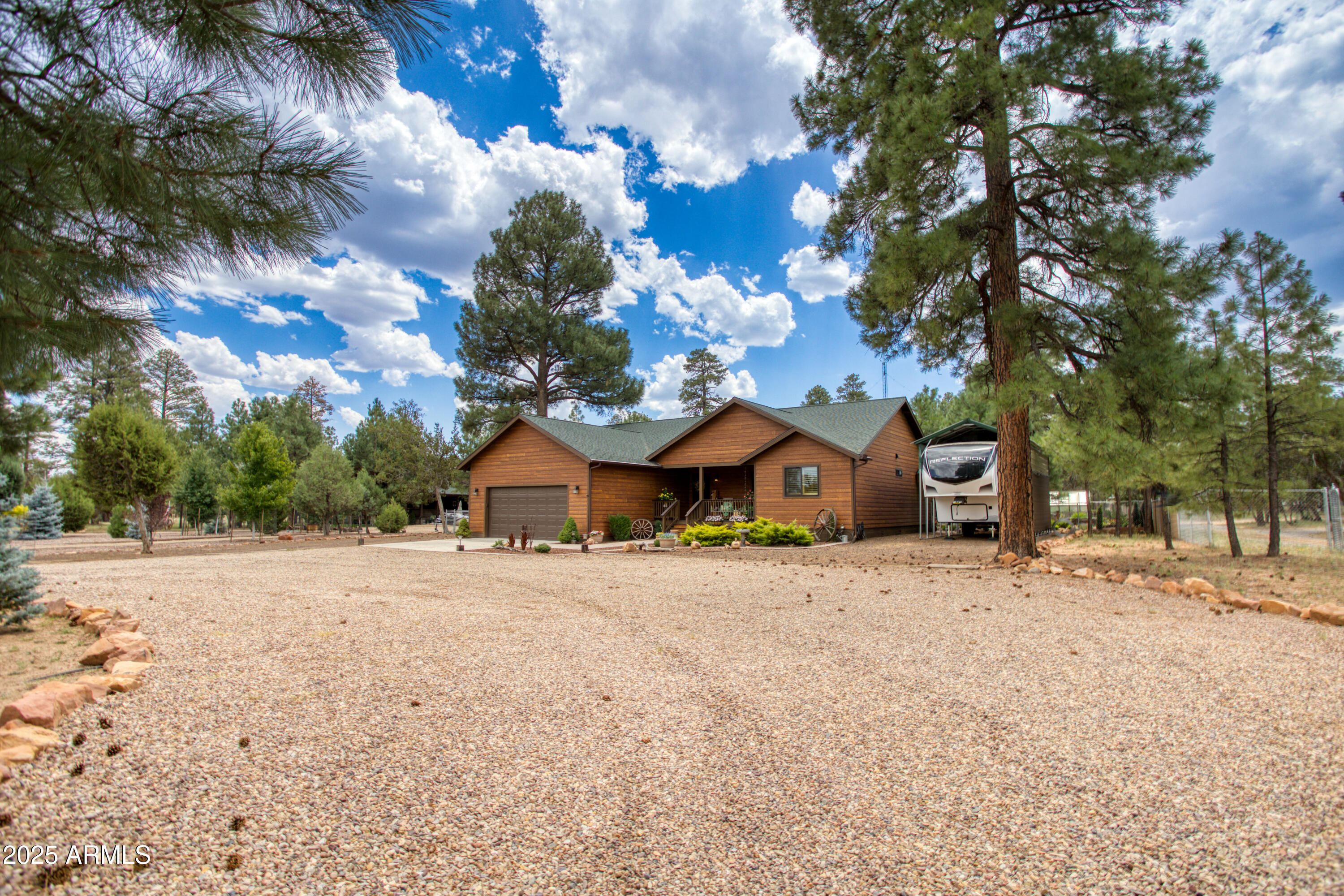 2050 Christmas Pine Road Overgaard, AZ 85933 - Photo 3 of 31 a view of a house with a yard