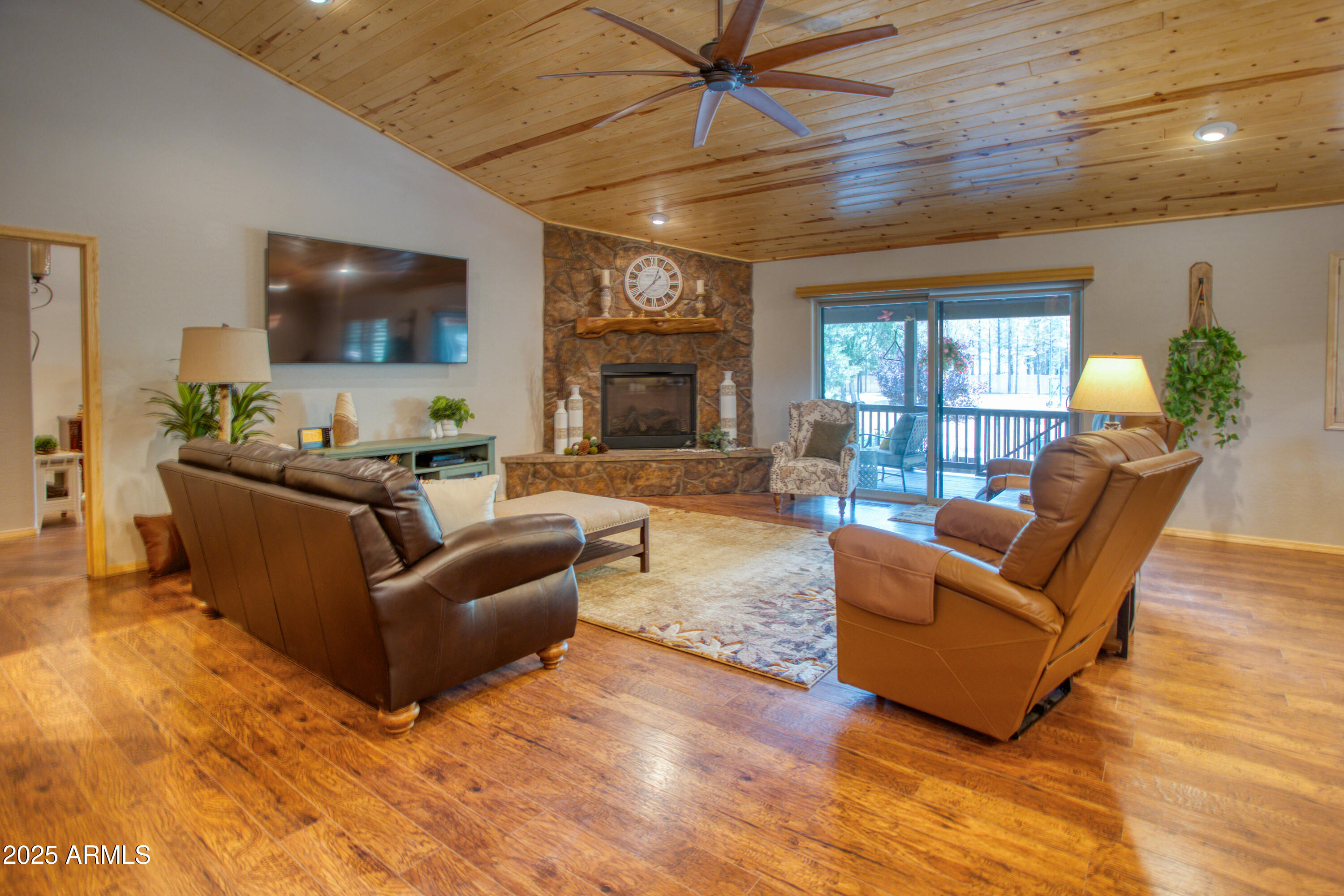 2050 Christmas Pine Road Overgaard, AZ 85933 - Photo 7 of 31 a living room with furniture and a flat screen tv