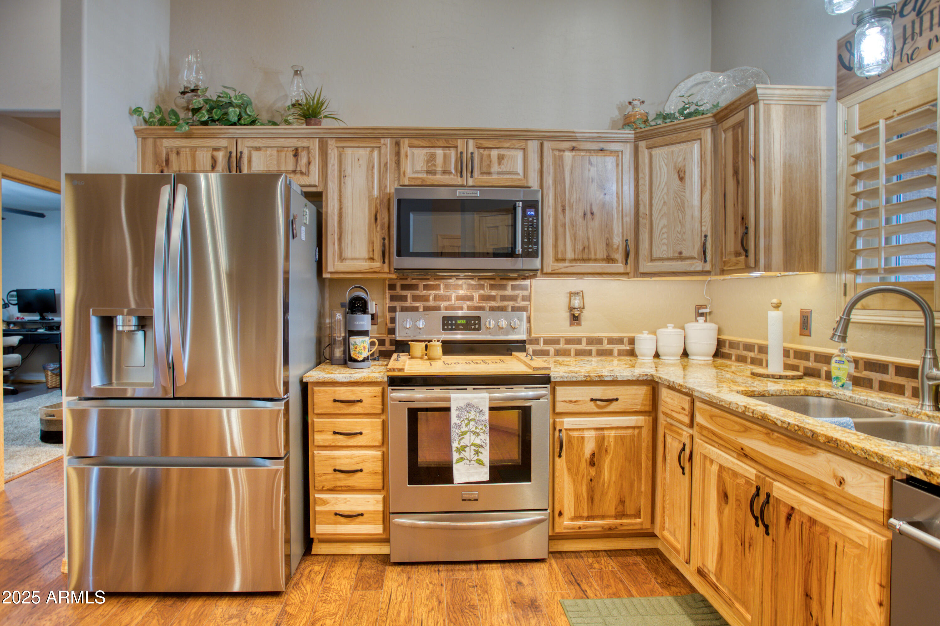 2050 Christmas Pine Road Overgaard, AZ 85933 - Photo 10 of 31 a kitchen with stainless steel appliances granite countertop a refrigerator stove and sink