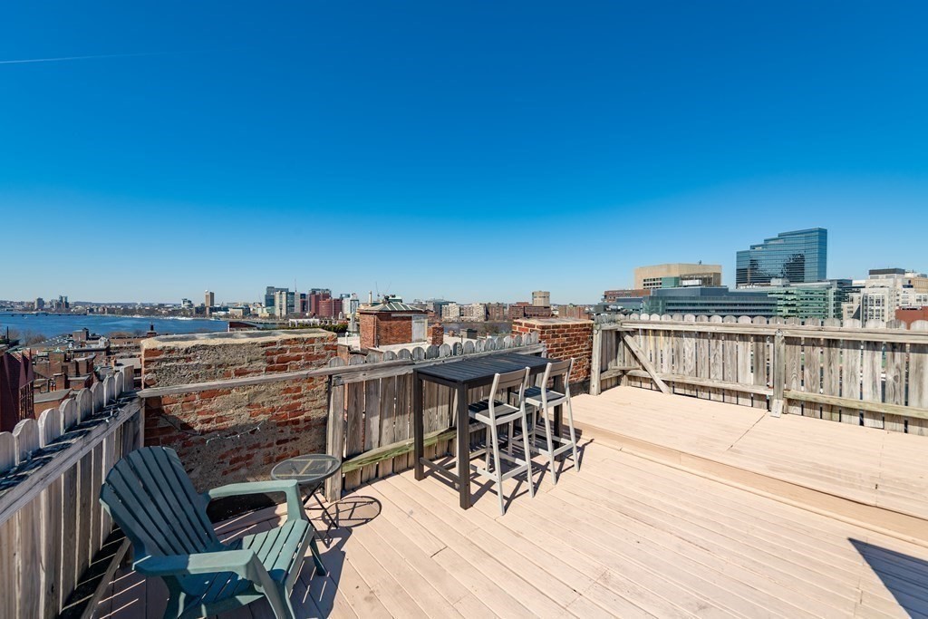 101 Myrtle Street, Unit A Boston, MA 02114 - Photo 14 of 15 a view of a terrace with furniture