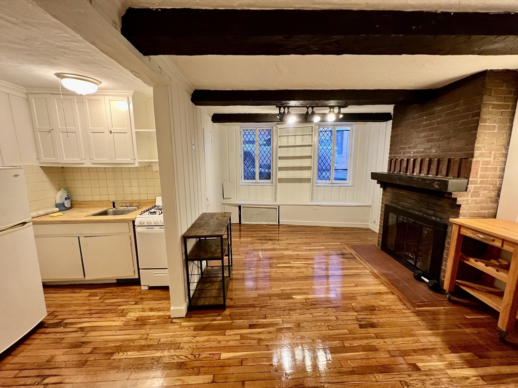 101 Myrtle Street, Unit A Boston, MA 02114 - Photo 2 of 15 a kitchen with sink and cabinets