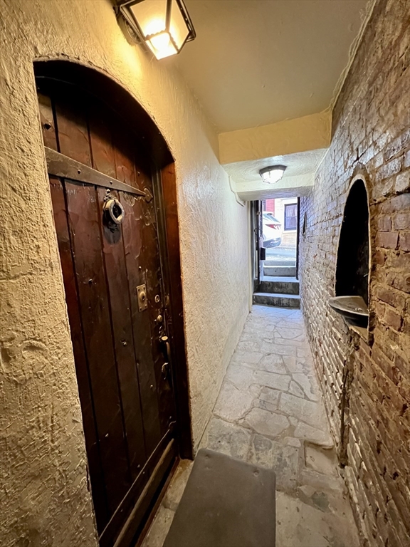 101 Myrtle Street, Unit A Boston, MA 02114 - Photo 7 of 15 a view of a entryway door of the house