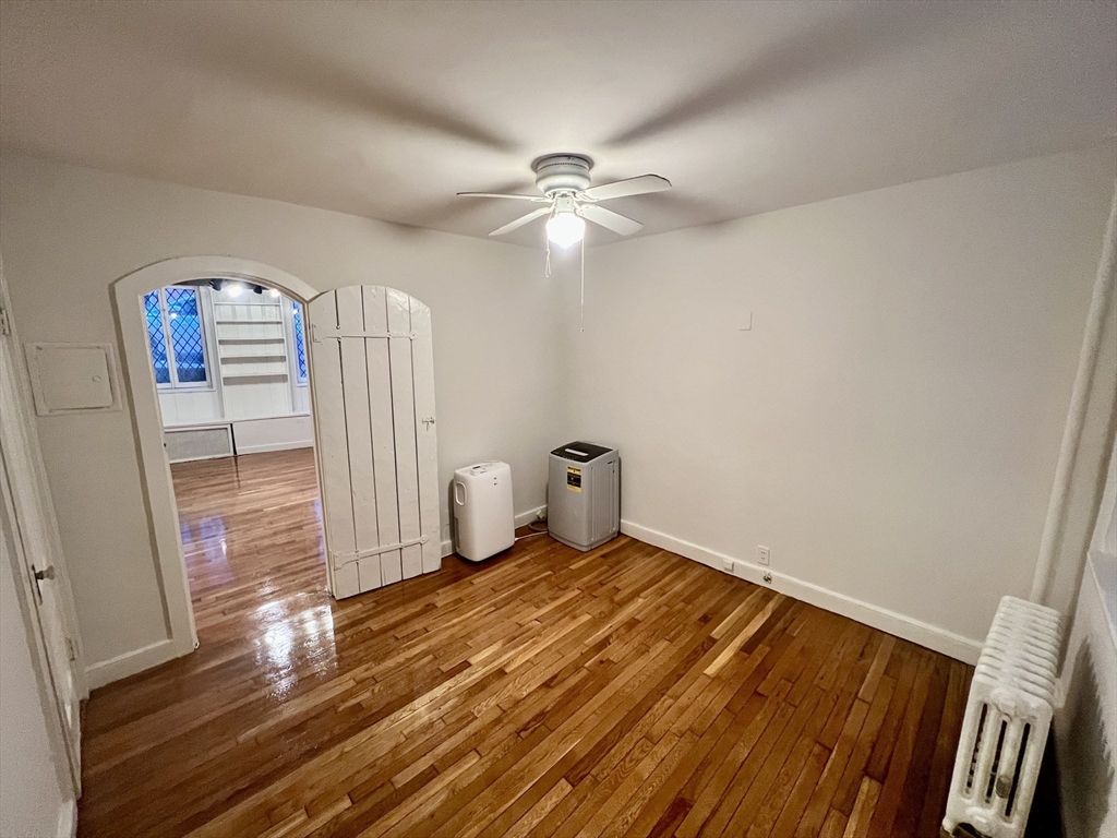 101 Myrtle Street, Unit A Boston, MA 02114 - Photo 8 of 15 a view of empty room with wooden floor