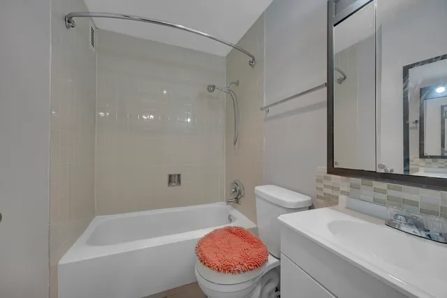 a bathroom with a sink a toilet and a bathtub