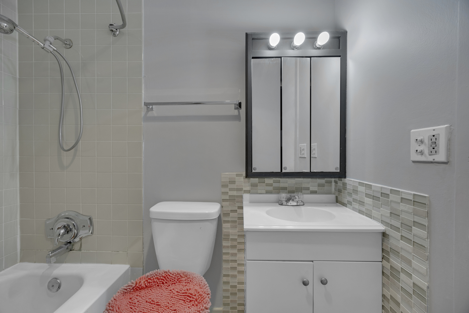 2901 South Michigan Avenue, Unit 908 Chicago, IL 60616 - Photo 7 of 22 a bathroom with a sink a toilet and shower