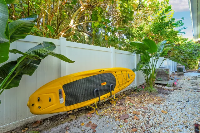 a view of a park with iron fence