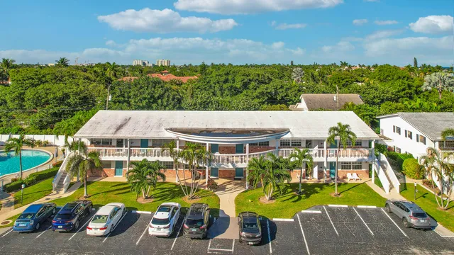 an aerial view of a house with outdoor space patio and ocean view