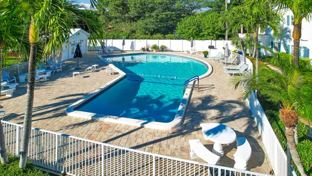 a view of a swimming pool with a patio