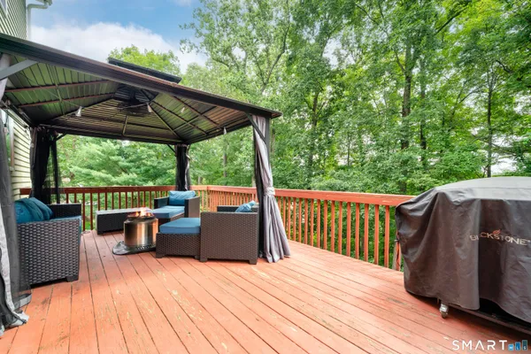 a view of deck with chairs and wooden floor